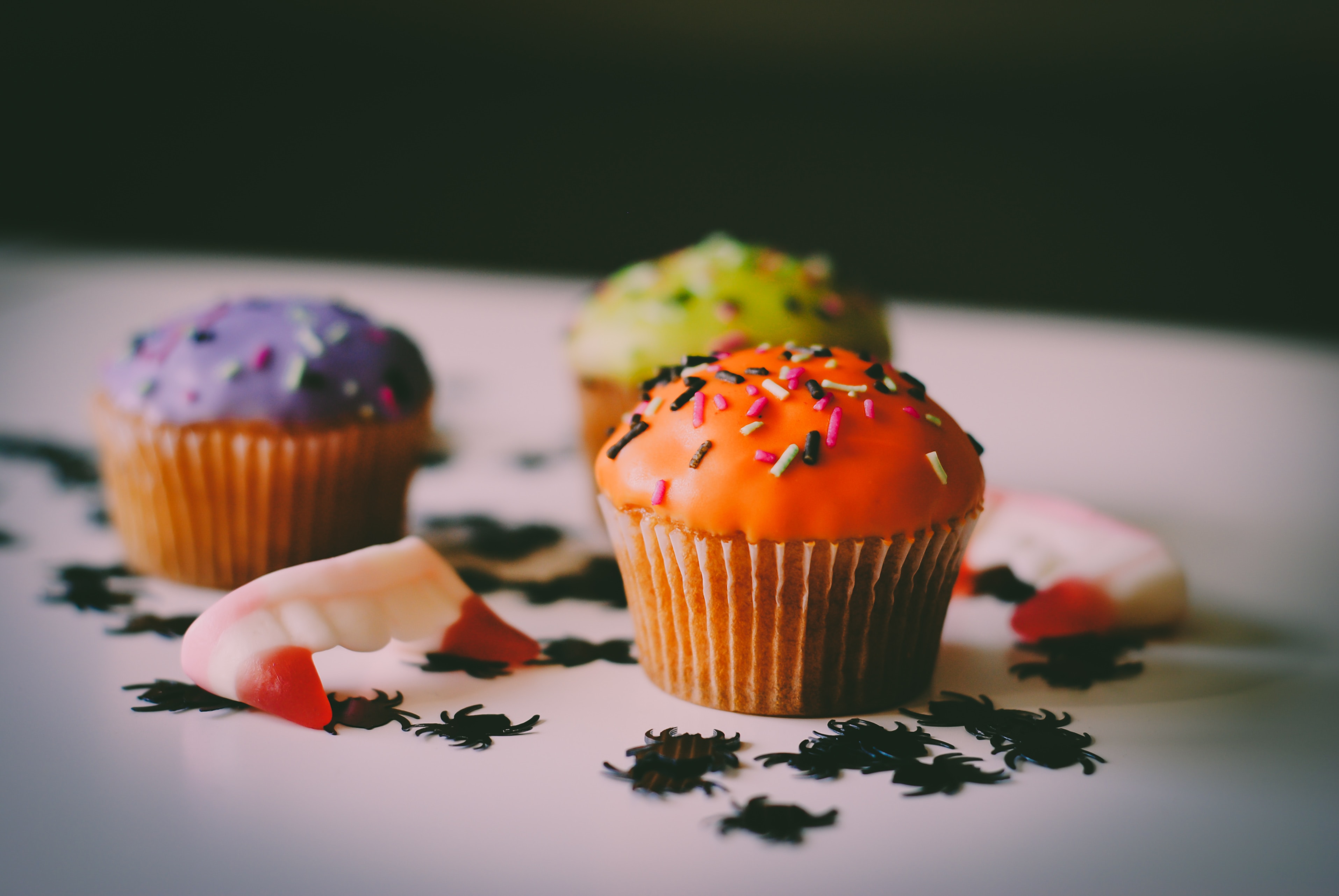 Colorful muffins in Halloween colors.