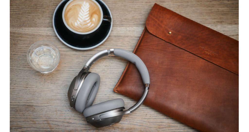 A pair of REAL BLUE PRO headphones on a table. Click to shop now.