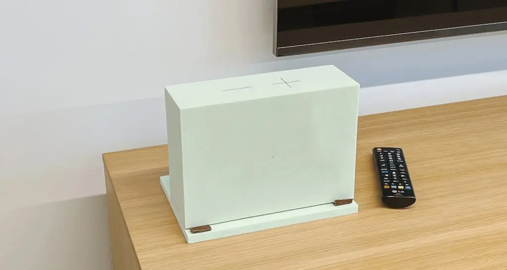 A MYND prototype sitting on a TV stand