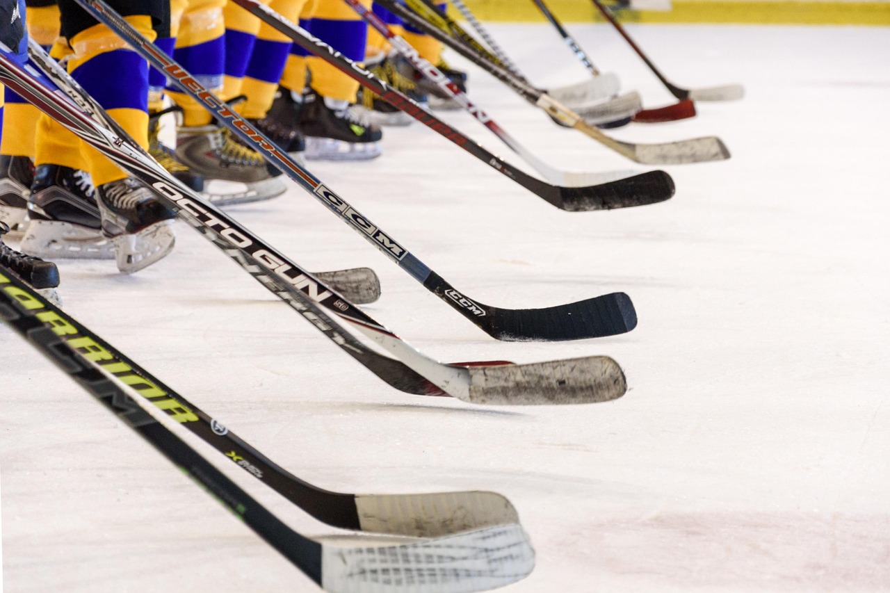 A view of the sticks and skates of a hockey team